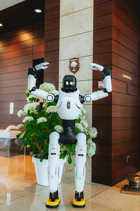 Humanoid robot greeting guests in a Monaco hotel lobby